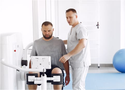 A spine doctor with a patient offering a personalised post spine treatment care.